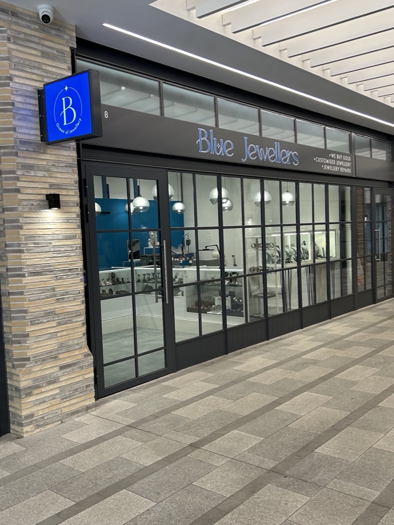 Blue Jewellers shopfront with its illuminated blue sign